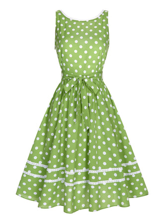 Abito a pois in pizzo con fiocco verde anni '50