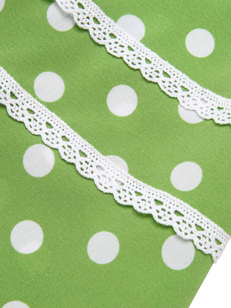 Abito a pois in pizzo con fiocco verde anni '50