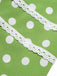 Abito a pois in pizzo con fiocco verde anni '50