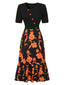 Abito patchwork floreale con scollatura irregolare nero anni '30