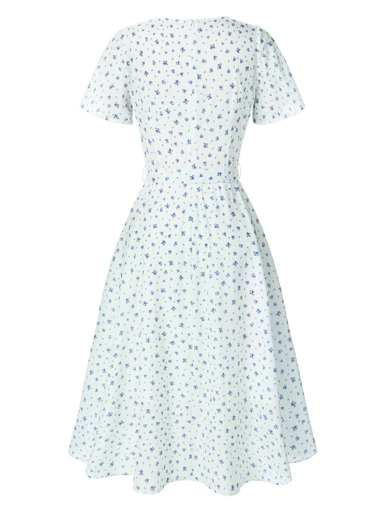 Abito floreale con cravatta obliqua in cotone bianco anni '40