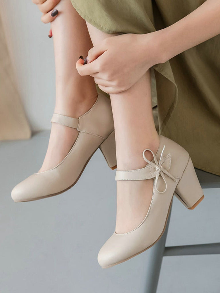 Scarpe con tacco grosso e fiocco punta tonda e tinta unita