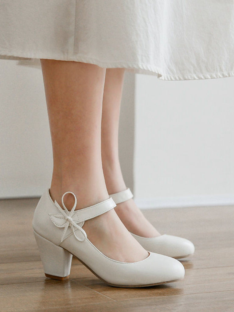 Scarpe con tacco grosso e fiocco punta tonda e tinta unita