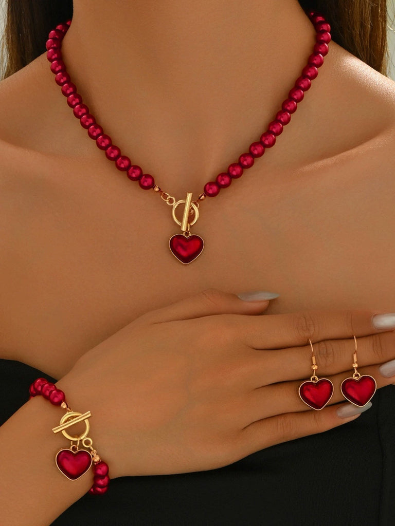 Set di collana e bracciale e orecchini con perle a cuore