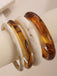 4PCS Set di Bracciali Rigidi Impilabili in Resina Marmorizzata Ambra e Avorio