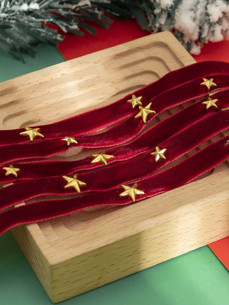 Collana larga in velluto con stella di Natale bordeaux