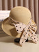 Cappello di paglia nero con fiocco a pois