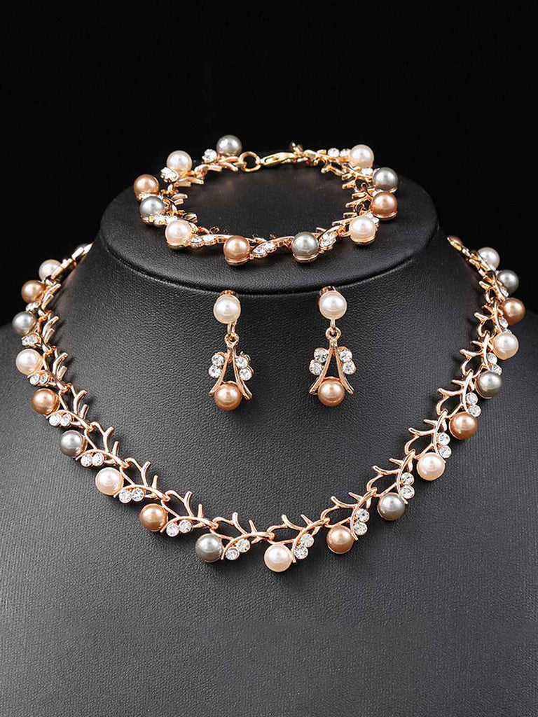Set di collana e bracciale e orecchini a forma di vite con perle