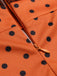 Abito aderente illusione arancione a pois anni '60