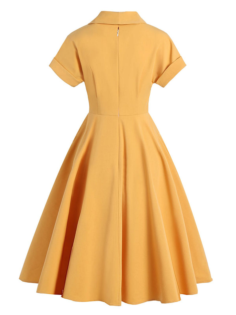 Abito a ruota bottoni giallo anni '50
