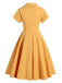 Abito a ruota bottoni giallo anni '50