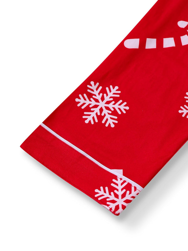 Pigiama con fiocco di neve e bastoncini di zucchero natalizi rosso anni '50