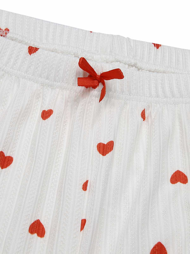 Pigiama a maniche lunghe con fiocco a cuore bianco anni '70