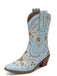 Light blue cowboy boot with floral patterns on a white background