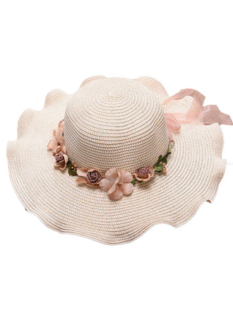 white straw hat with floral decorations on a white background