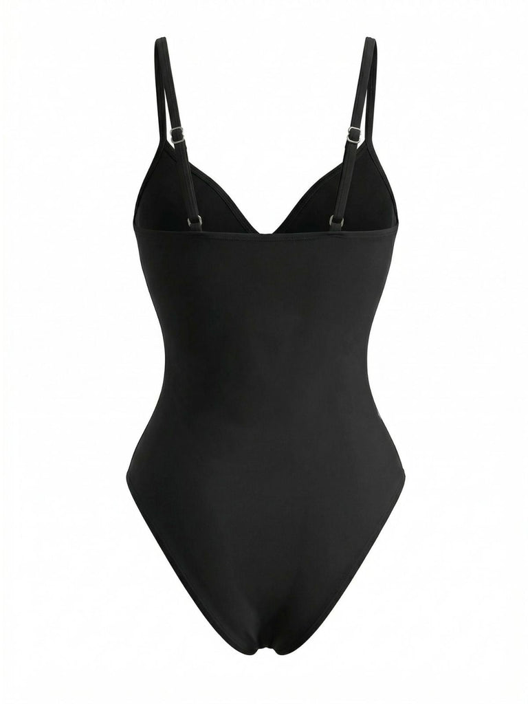 Rear studio view of the black swimsuit showcasing the simple, sleek back design and adjustable straps.