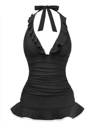 Front studio shot of the black halter swimsuit featuring a deep V ruffled neckline and a flattering skater-style skirted hem.
