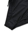 Close-up of the elastic leg opening and high-quality stitching on the black swimwear.