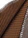 Close-up of brown textured material with a metallic edge