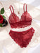 The burgundy lace lingerie set displayed on a white satin cloth with a rose, perfect for romantic gift ideas.