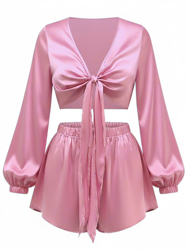 Front view of the silky satin tie-front set in a soft dusty pink color.
