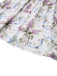 Close-up of the dress skirt showing the lightweight fabric drape and the bottom hem of the floral print.