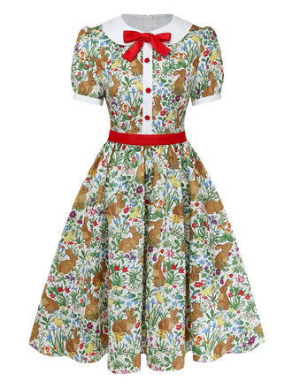 Front studio view of the bunny print dress highlighting the red waist cincher and button-down bodice.