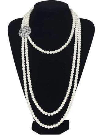 A Great Gatsby style long multi-strand pearl necklace displayed on a black mannequin, highlighting its elegant drape.