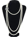 A Great Gatsby style long multi-strand pearl necklace displayed on a black mannequin, highlighting its elegant drape.