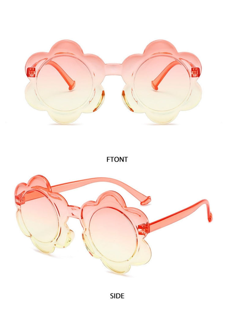 Vibrant orange to yellow gradient flower-shaped sunglasses featuring clear orange frames.