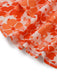 Close-up of orange and white floral fabric on a white background