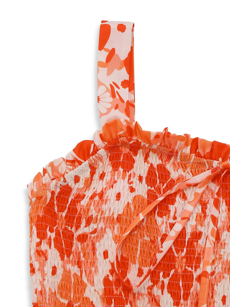 Orange and white floral patterned bag on a white background