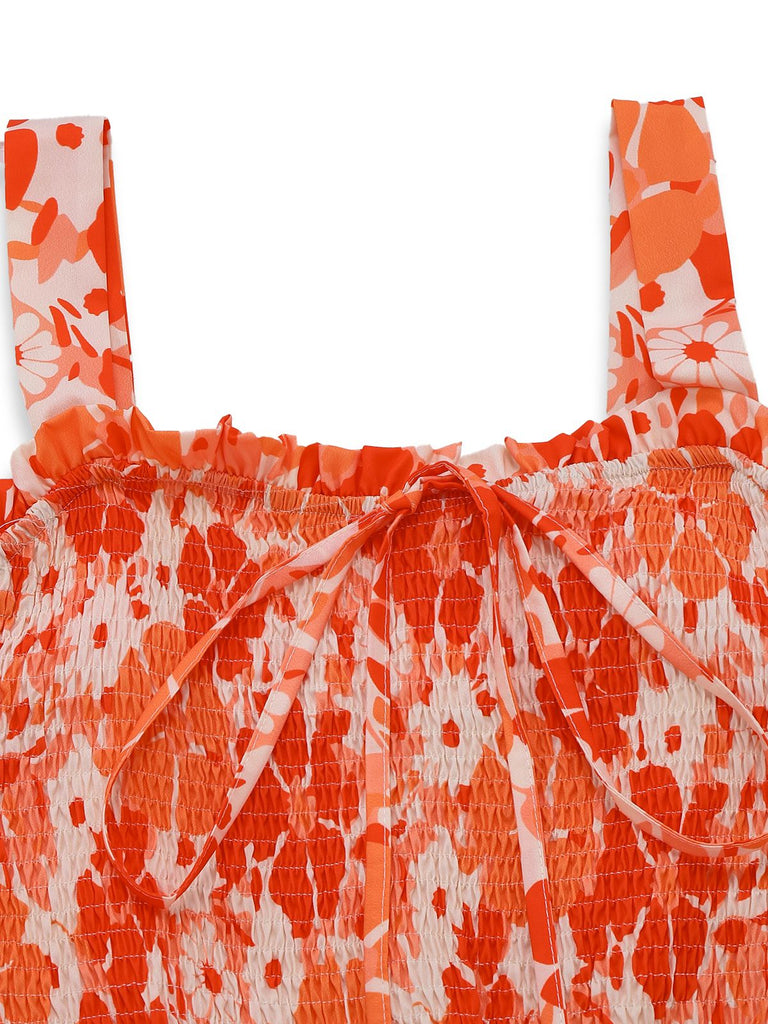 Orange and white floral patterned top on a white background