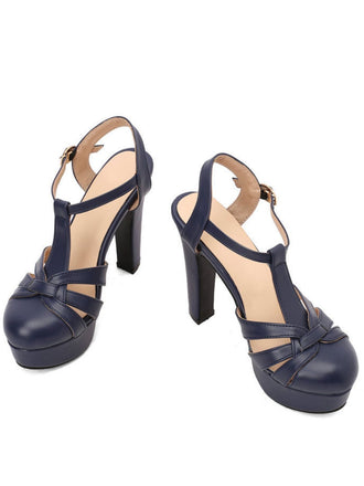 A pair of navy blue retro-style high-heeled sandals with adjustable ankle buckles and a classic T-strap design.