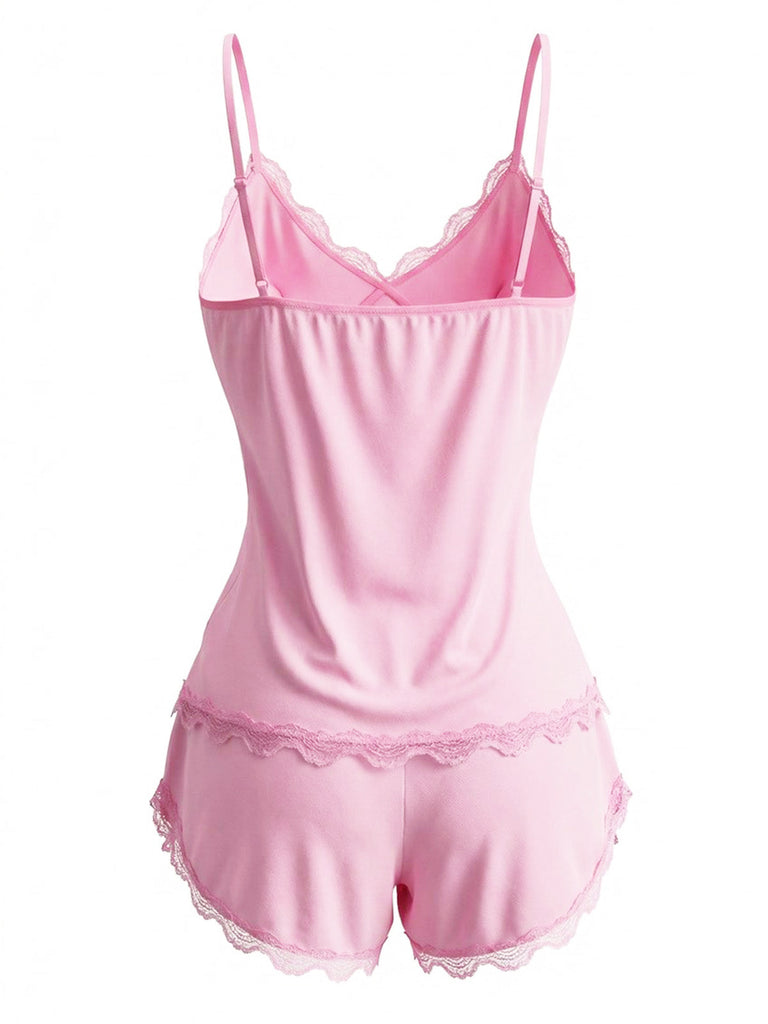 Back view of the pink lace-trim cami set, showcasing the elastic waistband and feminine ruffle hem on the shorts.