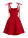 Rear view of the red fit and flare cocktail dress, highlighting the elegant silhouette and shoulder bow detail.