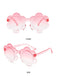 Red to pink gradient flower-shaped eyewear with transparent red frames displaying front and side angles.