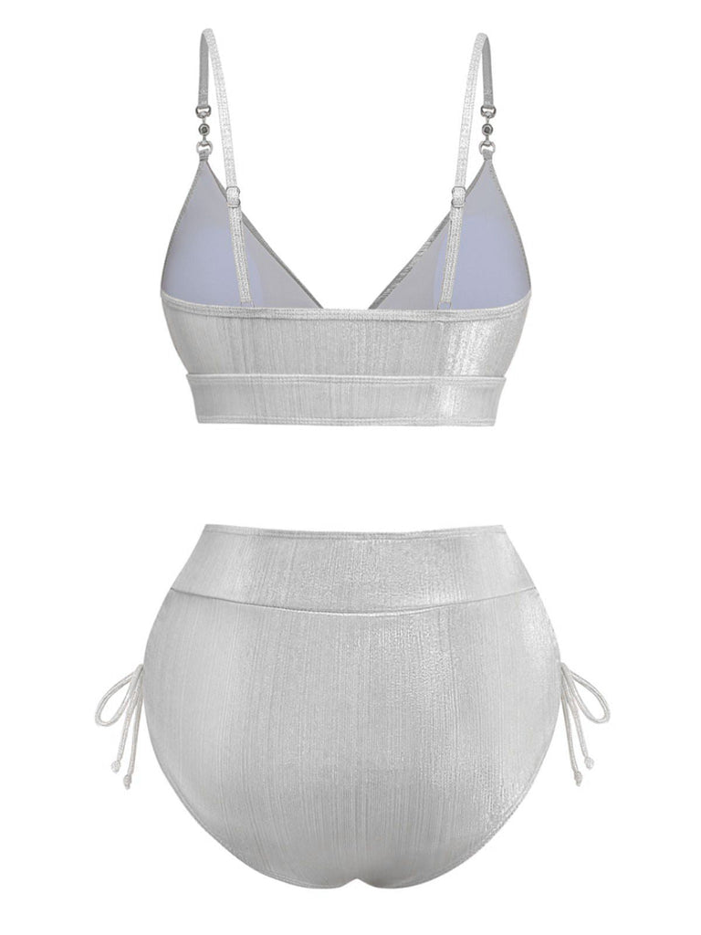 Back view of the silver shimmering bikini set, showcasing the metallic finish and high-waist fit.