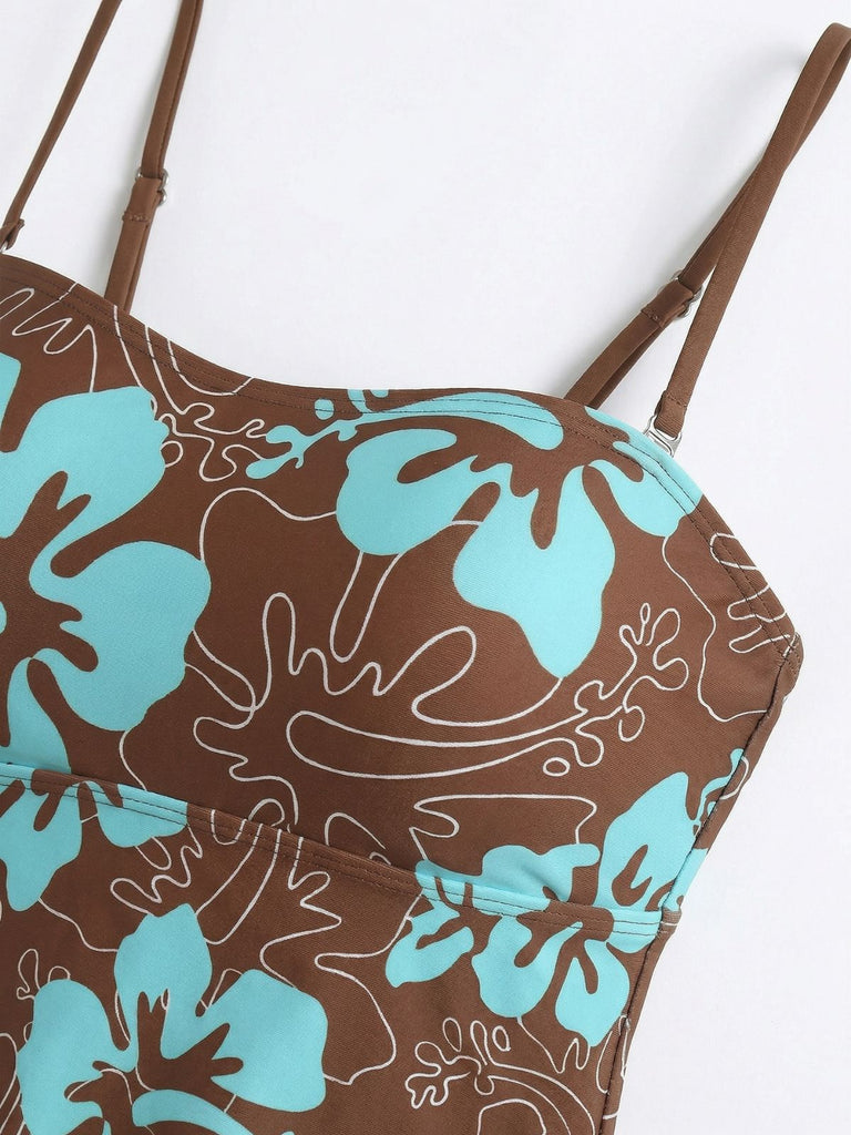 Close-up of the sweetheart neckline and thin adjustable shoulder straps on the brown floral swimsuit.