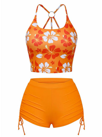Front view of the orange floral bikini set, highlighting the scoop neck top and high-waisted swim shorts.