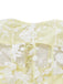 Close-up shot of the bodice area showing the fine white floral lace embroidery on the yellow fabric.