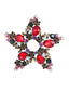 Spilla di strass con stella di Natale retrò