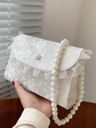 Borsa trapuntata in pizzo con catena di perle retrò