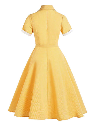 Vestito giallo con cintura scozzese anni '50