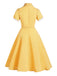 Vestito giallo con cintura scozzese anni '50