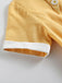Vestito giallo con cintura scozzese anni '50