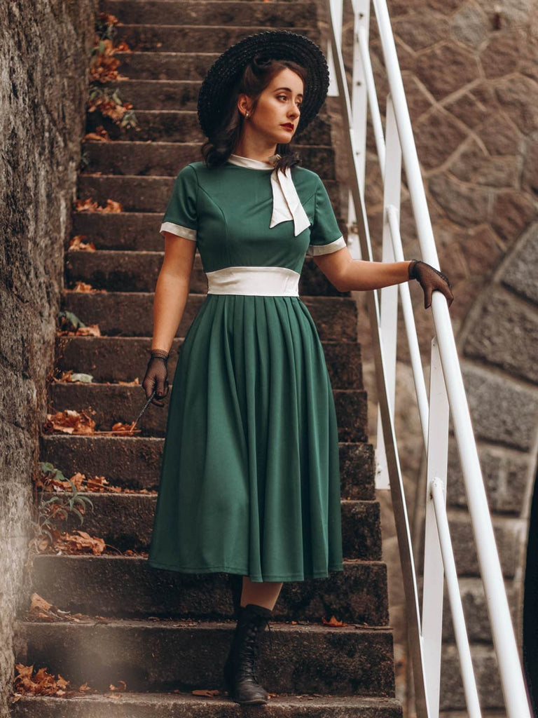 Vestito altalena con fiocco e collo in piedi anni '50