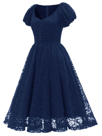 Abito in pizzo con perline e maniche a sbuffo anni '50