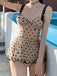 Costume da bagno con gonna a balze a pois
