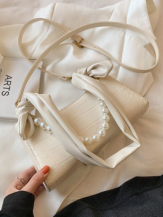 Borsa hobo in tinta unita con catena di perle retrò